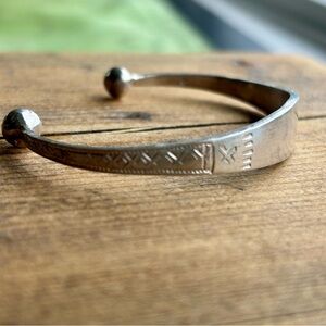 hand-stamped X for Navajo (or Navajo-style) sterling or nickel-silver cuff